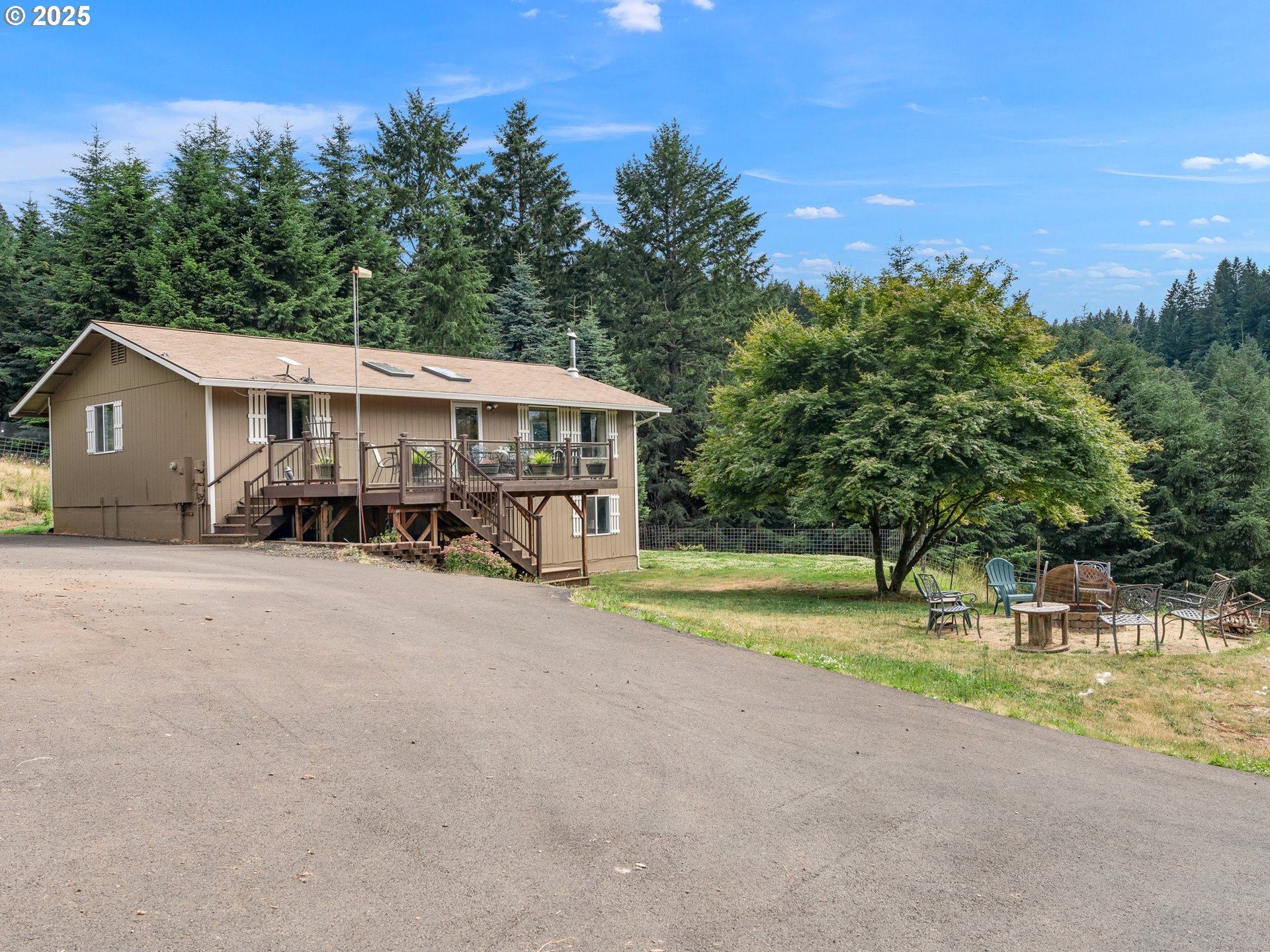 19791 Northeast Sunnycrest Road Newberg, OR 97132 - Photo 4 of 40 a view of a house with a yard and sitting area