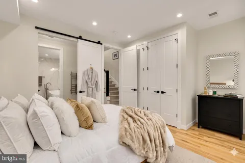 a bedroom with a bed and a walk in closet