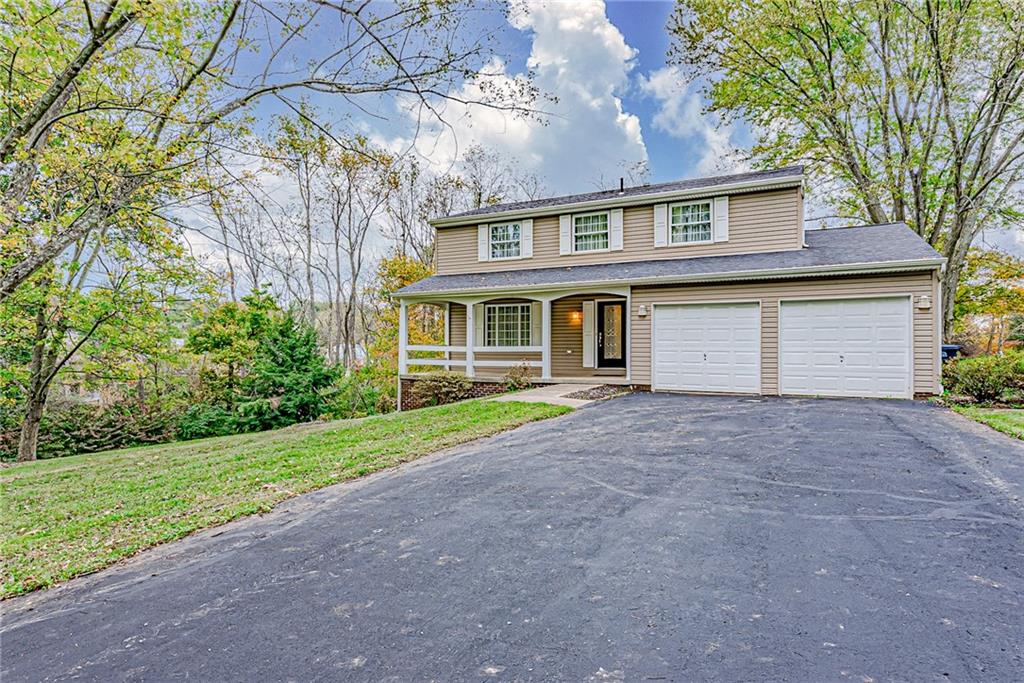 5830 Claridge Export Road Export, PA 15632 - Photo 1 of 25 a house view with a garden space