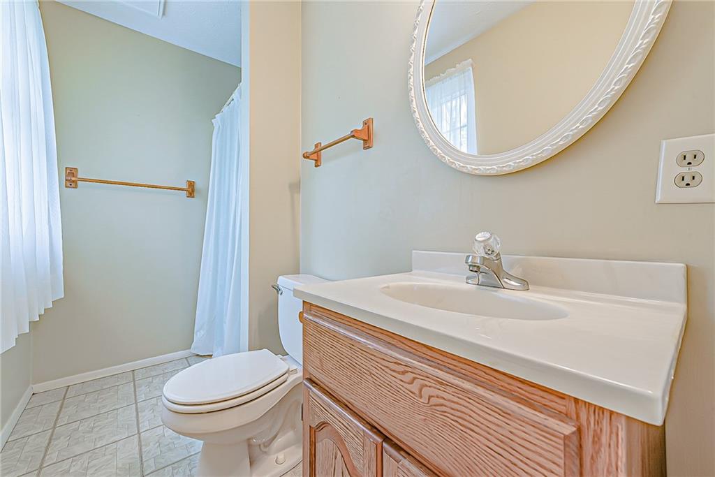 5830 Claridge Export Road Export, PA 15632 - Photo 12 of 25 a bathroom with a sink a toilet and mirror