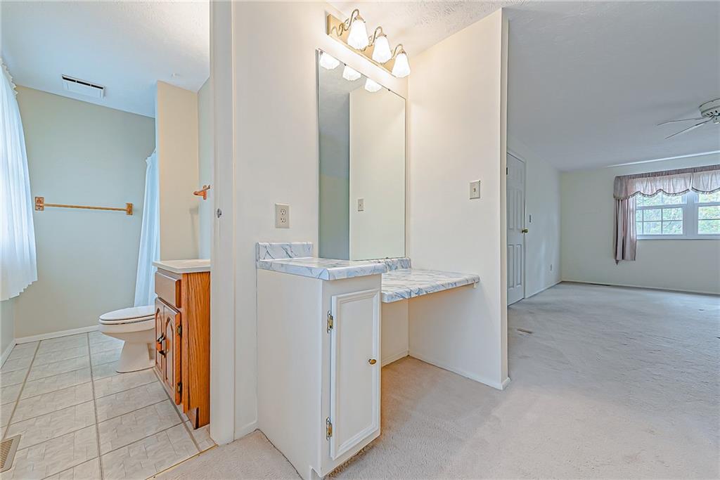 5830 Claridge Export Road Export, PA 15632 - Photo 13 of 25 a bathroom with a sink and a mirror