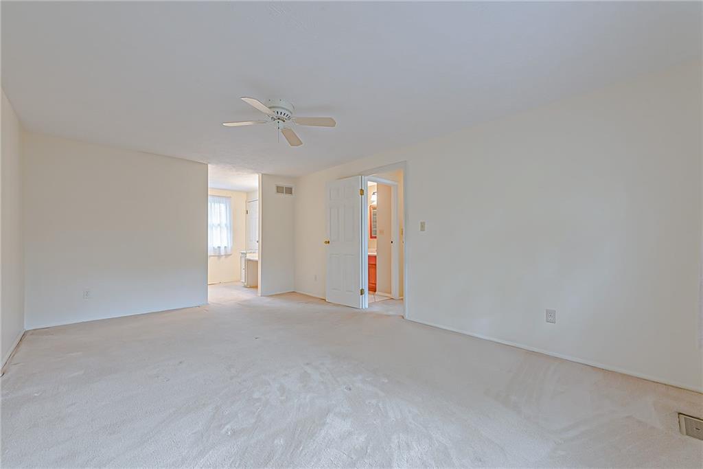 5830 Claridge Export Road Export, PA 15632 - Photo 17 of 25 an empty room with an entryway and fan