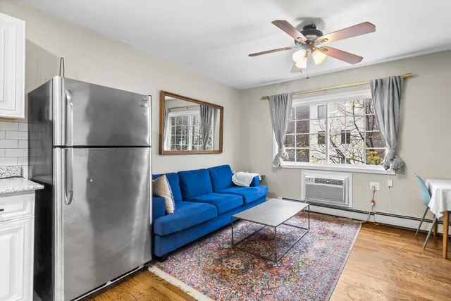 a living room with a couch and a window