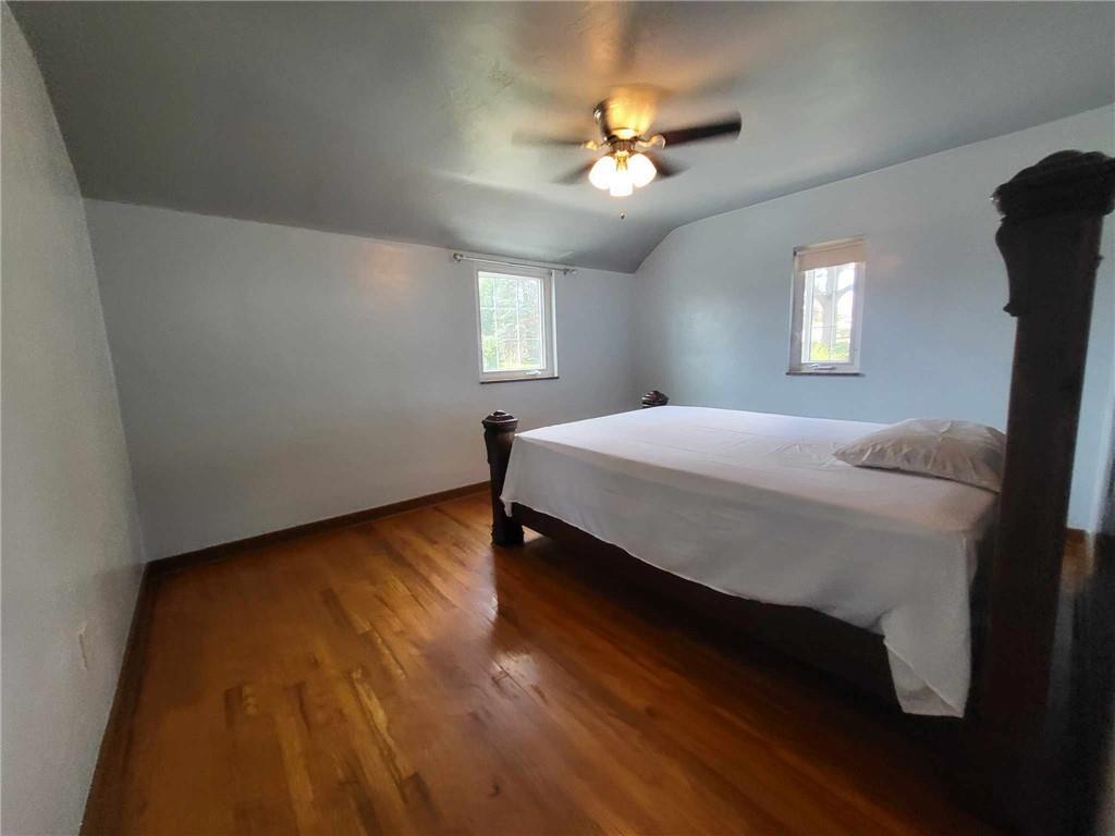 4971 Roberta Drive Pittsburgh, PA 15236 - Photo 15 of 27 a bedroom with a bed and a chandelier