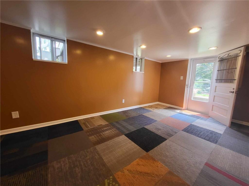 4971 Roberta Drive Pittsburgh, PA 15236 - Photo 19 of 27 a view of empty room with wooden floor and fan
