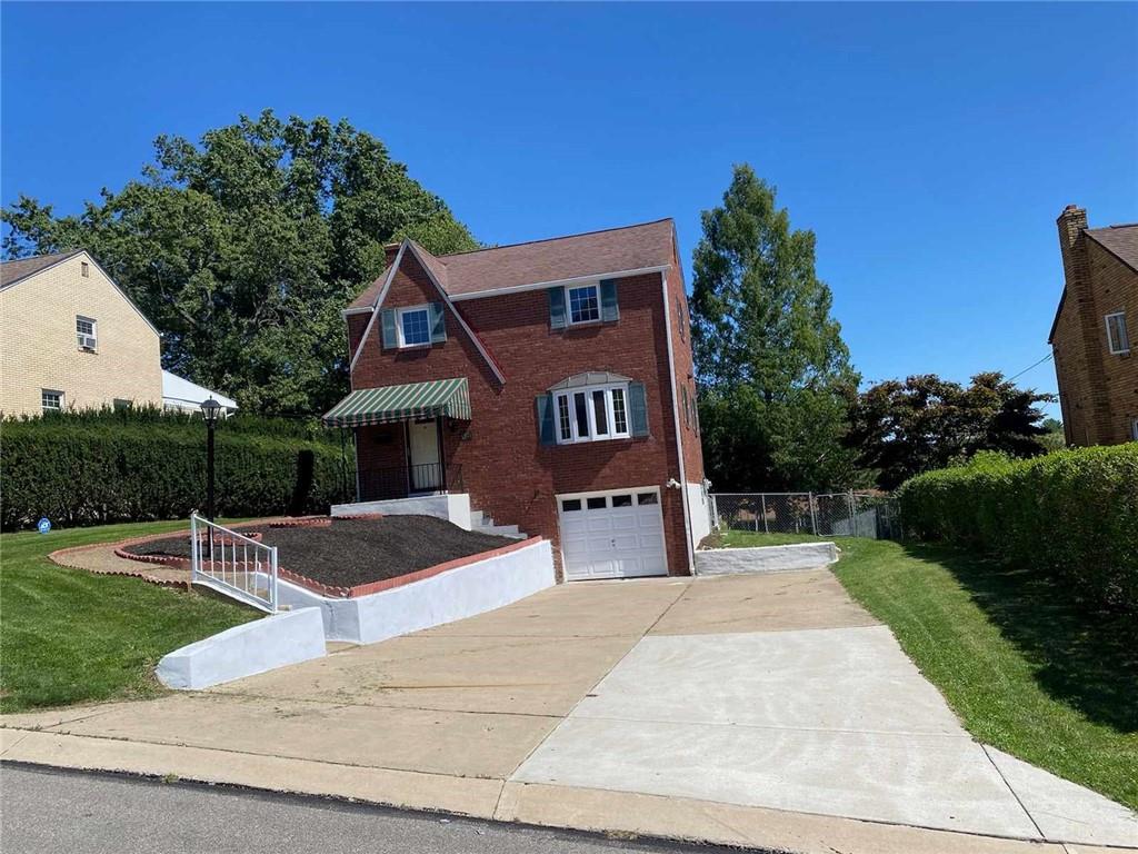 4971 Roberta Drive Pittsburgh, PA 15236 - Photo 2 of 27 a front view of a house with yard and green space