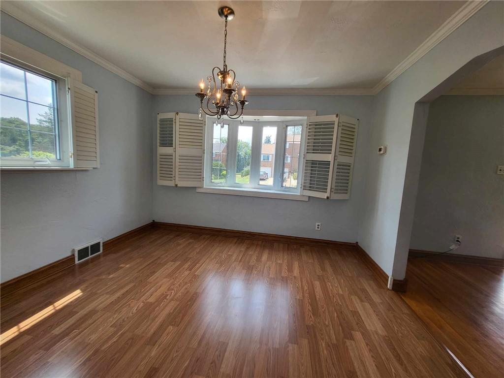 4971 Roberta Drive Pittsburgh, PA 15236 - Photo 8 of 27 an empty room with wooden floor and windows