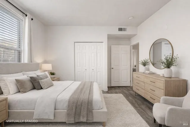 a bedroom with a bed and a dresser
