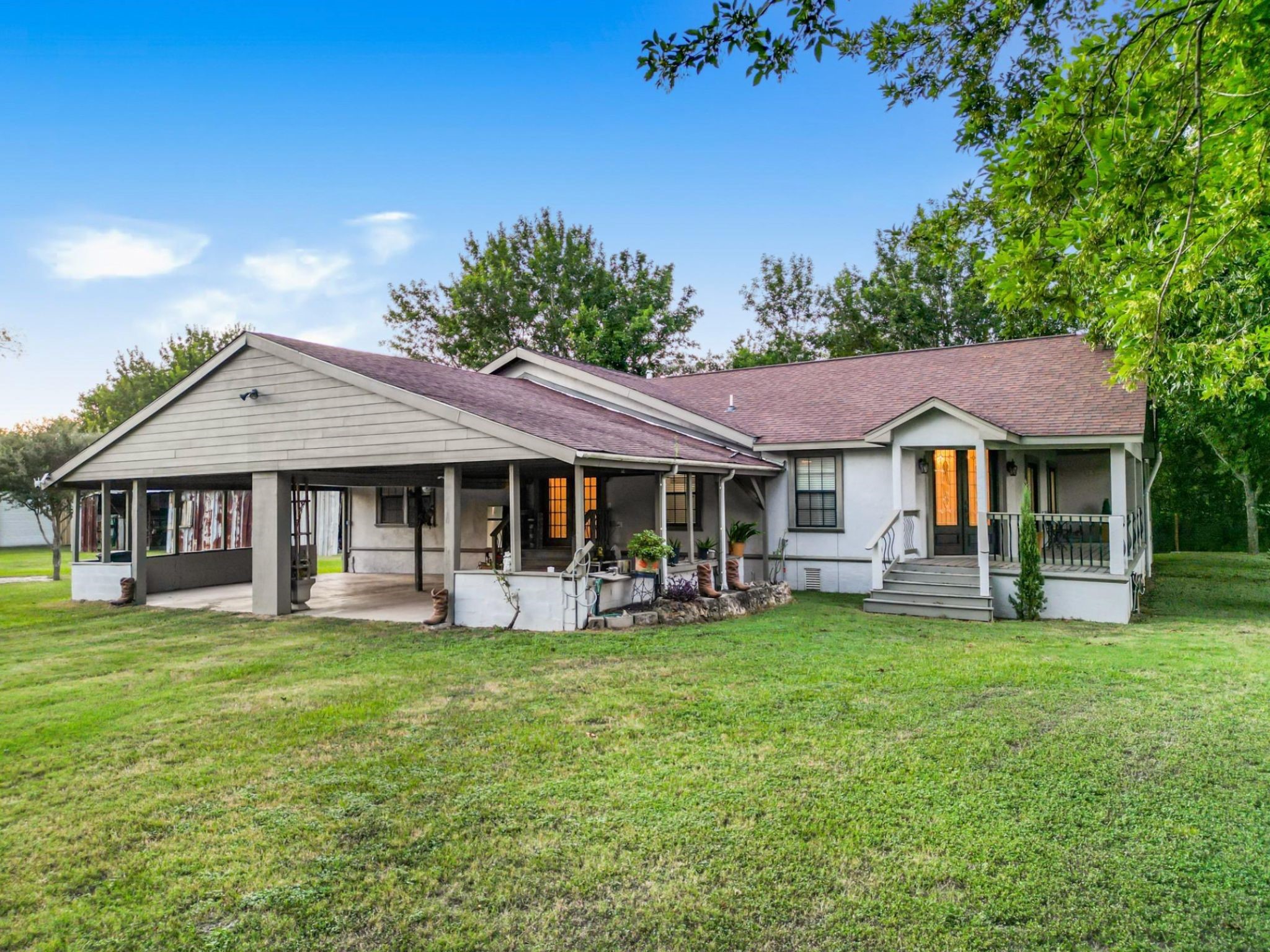 9731 Hadden Road Baytown, TX 77521 - Photo 5 of 47 a view of a house with garden and trees