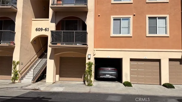 a front view of a house with a garage