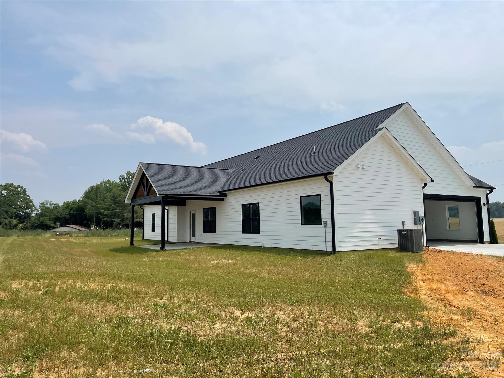 1327 Stack Road Monroe, NC 28112 - Photo 3 of 9 a house with garden