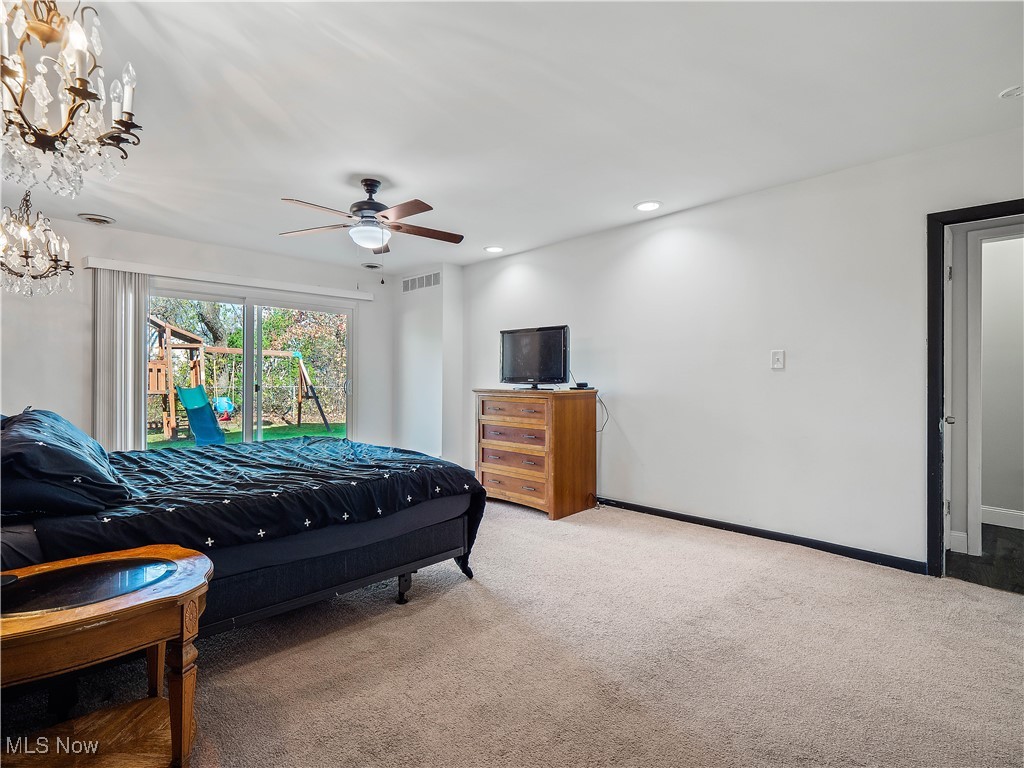 6377 Fairhaven Road Cleveland, OH 44124 - Photo 27 of 33 Bedroom with carpet flooring and ceiling fan with notable chandelier