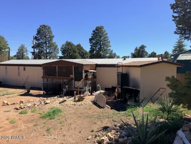 2019 Broken Arrow Road Overgaard, AZ 85933 - Photo 19 of 19 a view of backyard of house with car parked