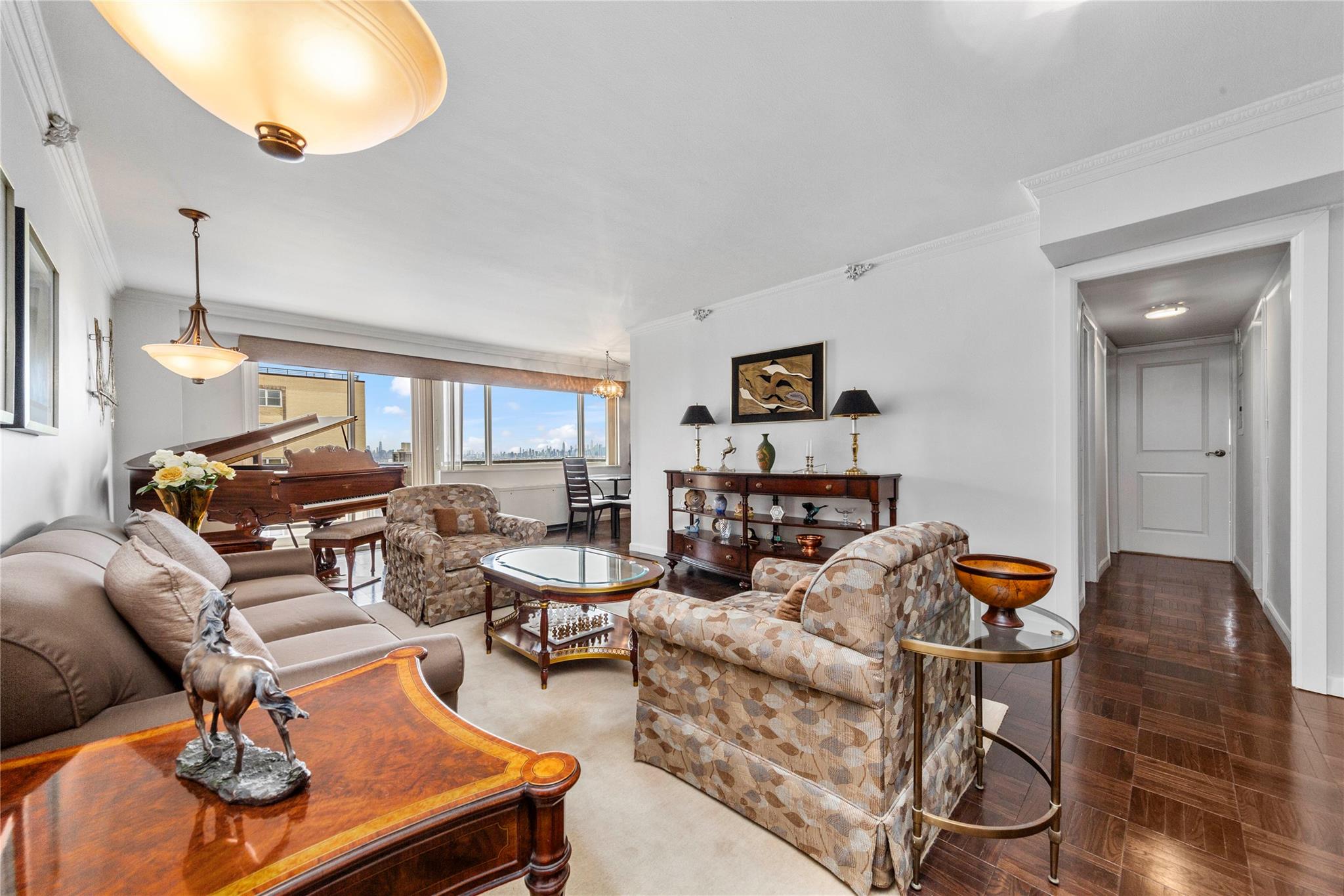 a living room with furniture and wooden floor