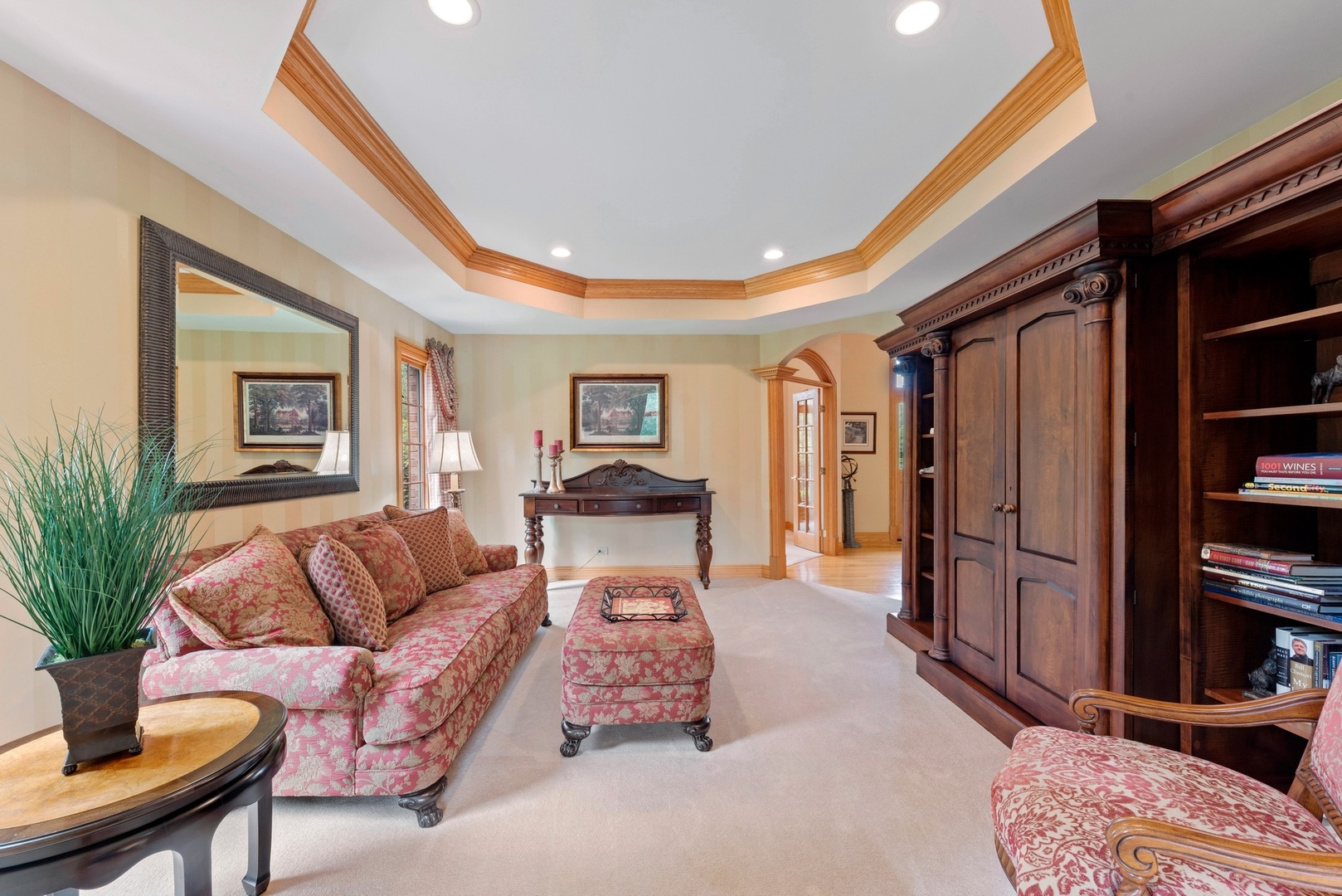776 North Inverway Road Inverness, IL 60067 - Photo 2 of 31 a living room with furniture a bookshelf and a flat screen tv
