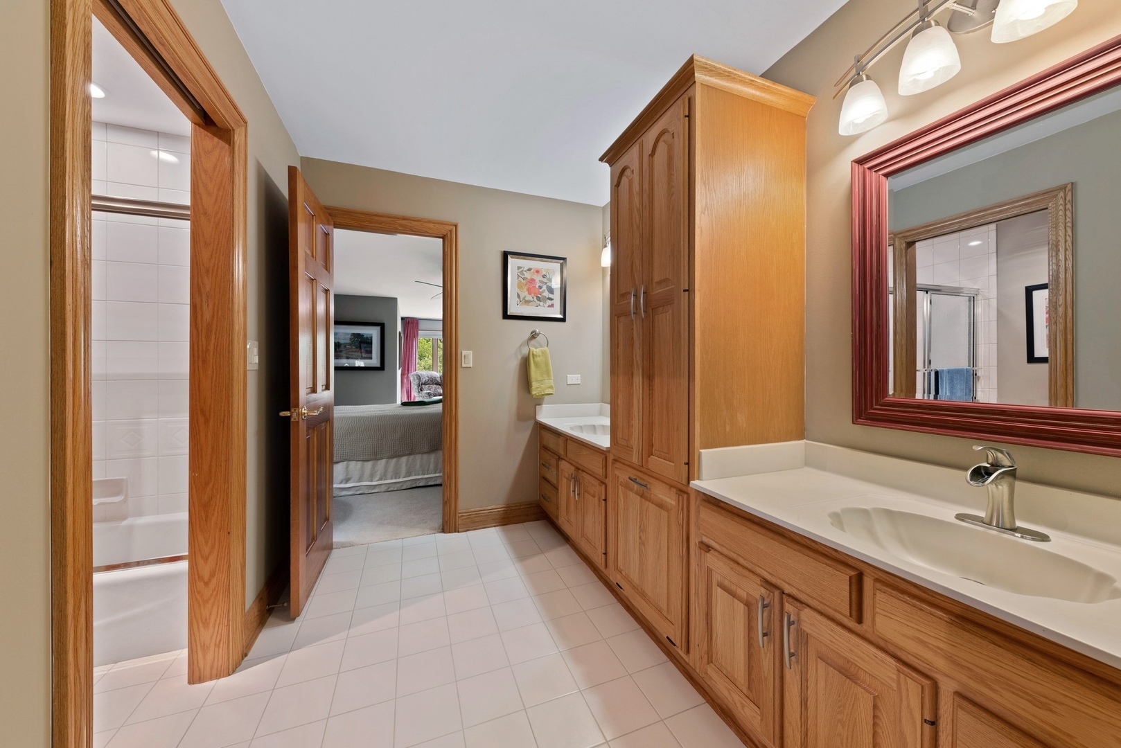 776 North Inverway Road Inverness, IL 60067 - Photo 15 of 31 a bathroom with a sink a mirror and a shower