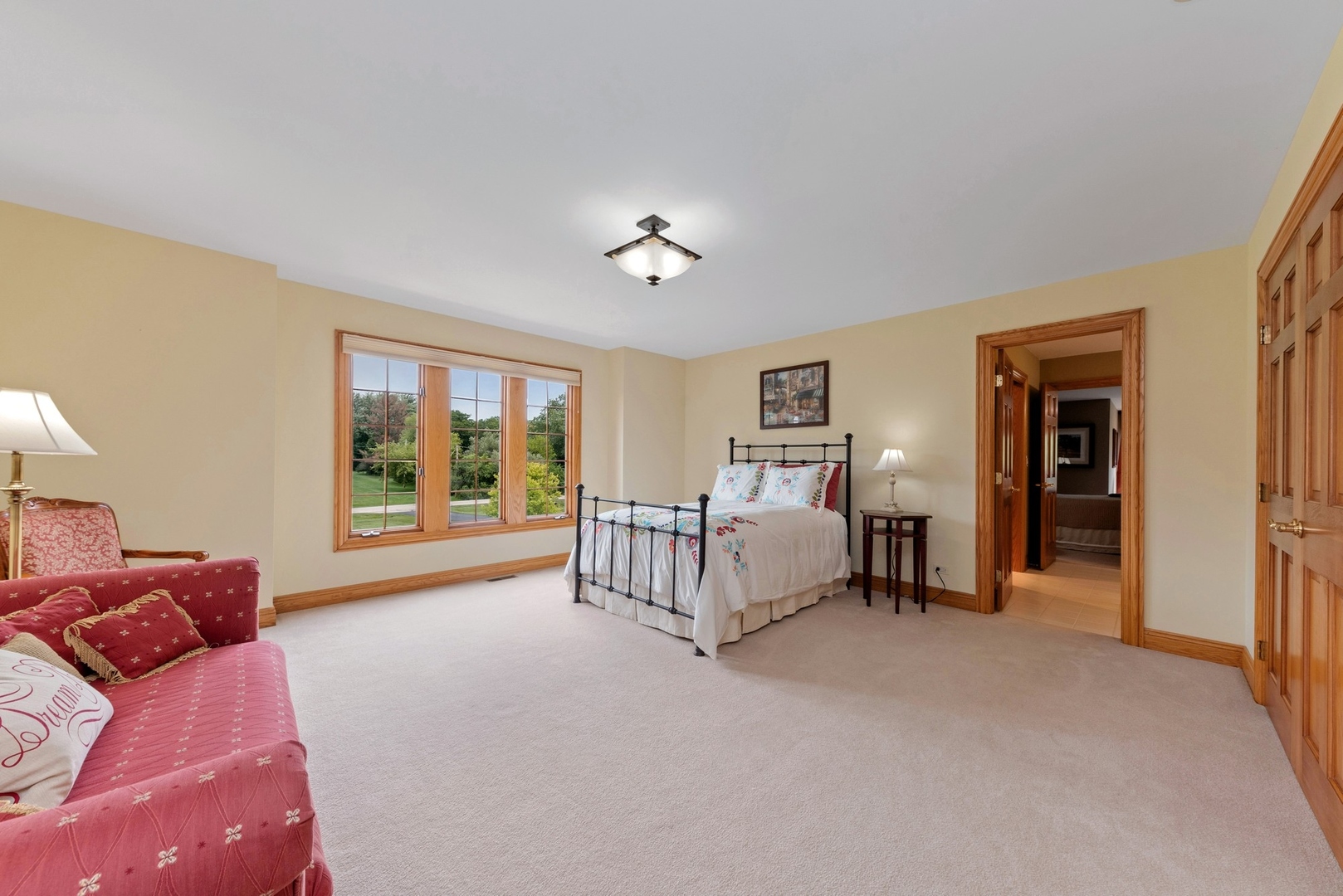 776 North Inverway Road Inverness, IL 60067 - Photo 16 of 31 a spacious bedroom with a bed and a large window