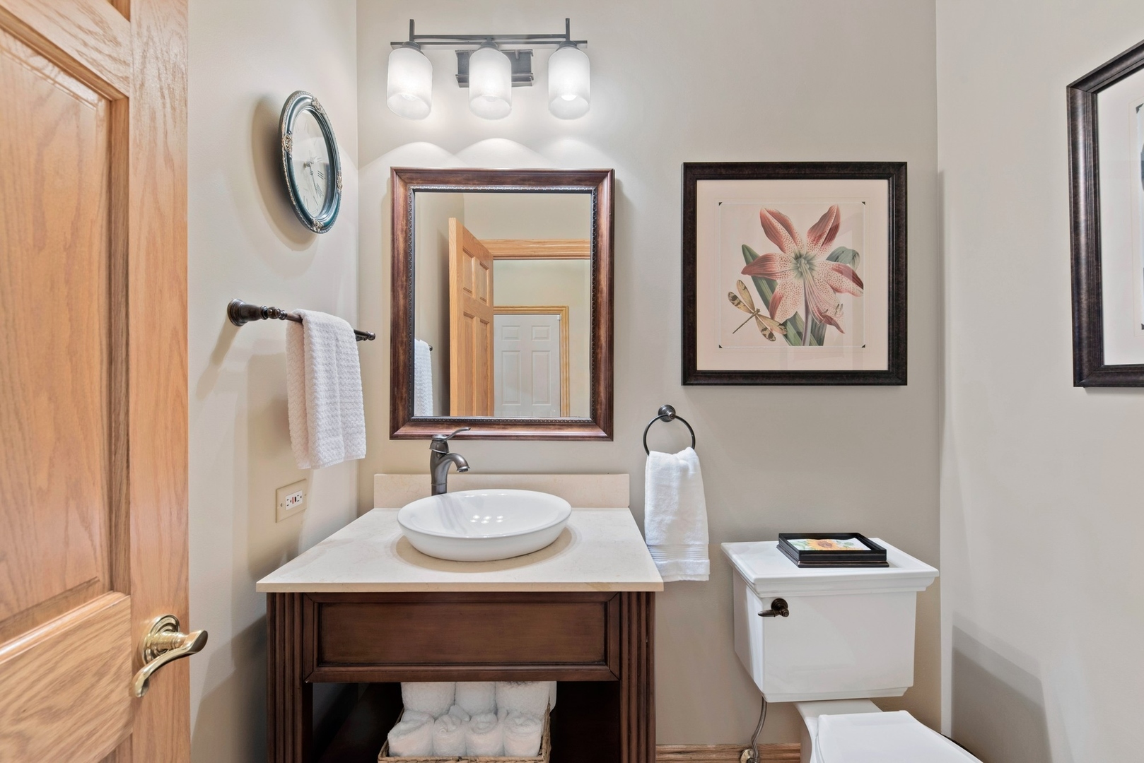 776 North Inverway Road Inverness, IL 60067 - Photo 19 of 31 a bathroom with a toilet a sink and a mirror