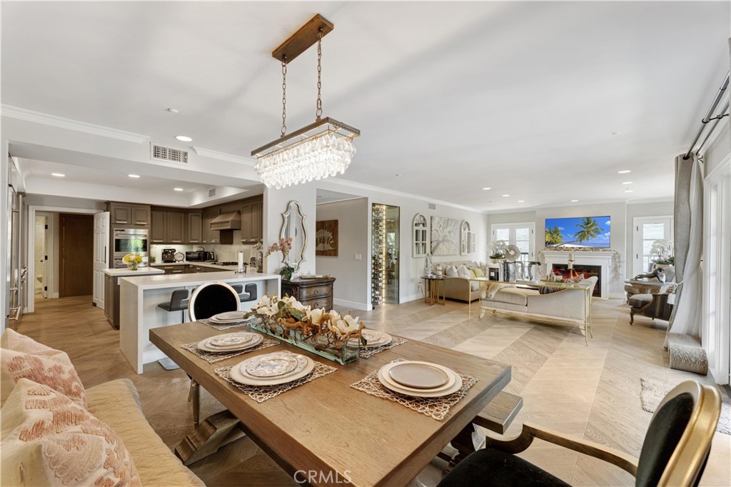 277 South Spalding Drive, Unit 201 Beverly Hills, CA 90212 - Photo 12 of 31 a living room with furniture and a view of kitchen
