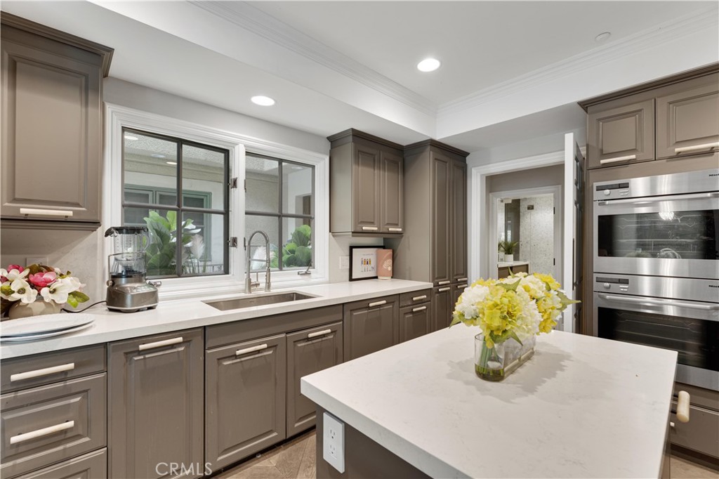 277 South Spalding Drive, Unit 201 Beverly Hills, CA 90212 - Photo 14 of 31 a kitchen with sink and window