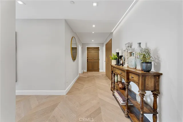 a view of an entryway with wooden floor