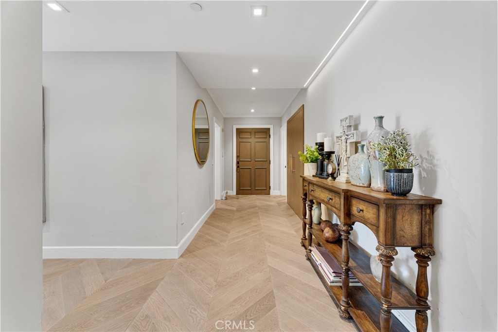 277 South Spalding Drive, Unit 201 Beverly Hills, CA 90212 - Photo 17 of 31 a view of an entryway with wooden floor