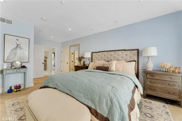 a bed room with a bed and a chair