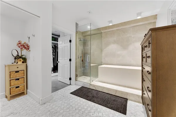 a bathroom with a shower and a sink