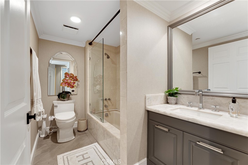 277 South Spalding Drive, Unit 201 Beverly Hills, CA 90212 - Photo 24 of 31 a bathroom with a sink toilet and shower