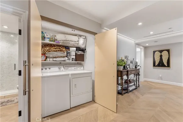 a view of kitchen with sink and refrigerator