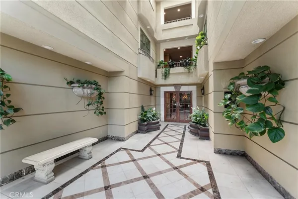 a building with potted plants in front of it
