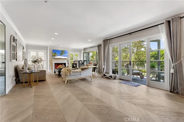 a living room with furniture and large windows