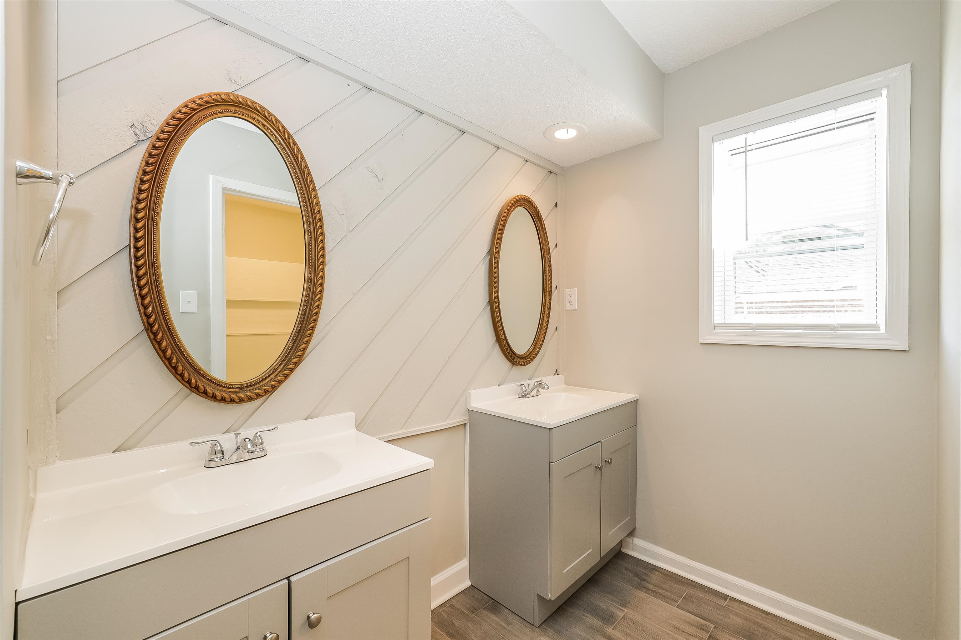 3054 Ridgeway Road Memphis, TN 38115 - Photo 11 of 17 a bathroom with a sink and a mirror