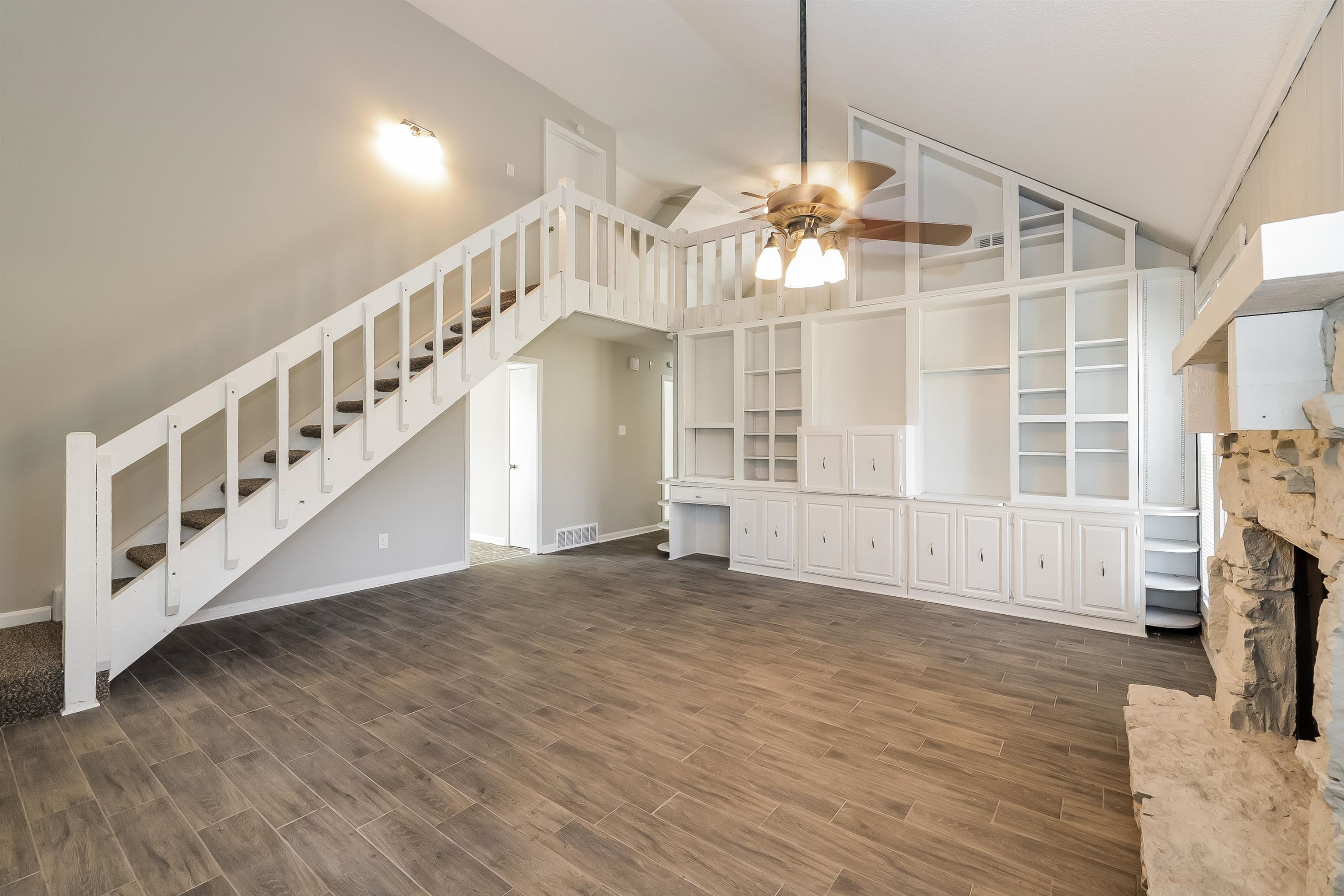 3054 Ridgeway Road Memphis, TN 38115 - Photo 3 of 17 a view of empty room with fireplace and wooden floor