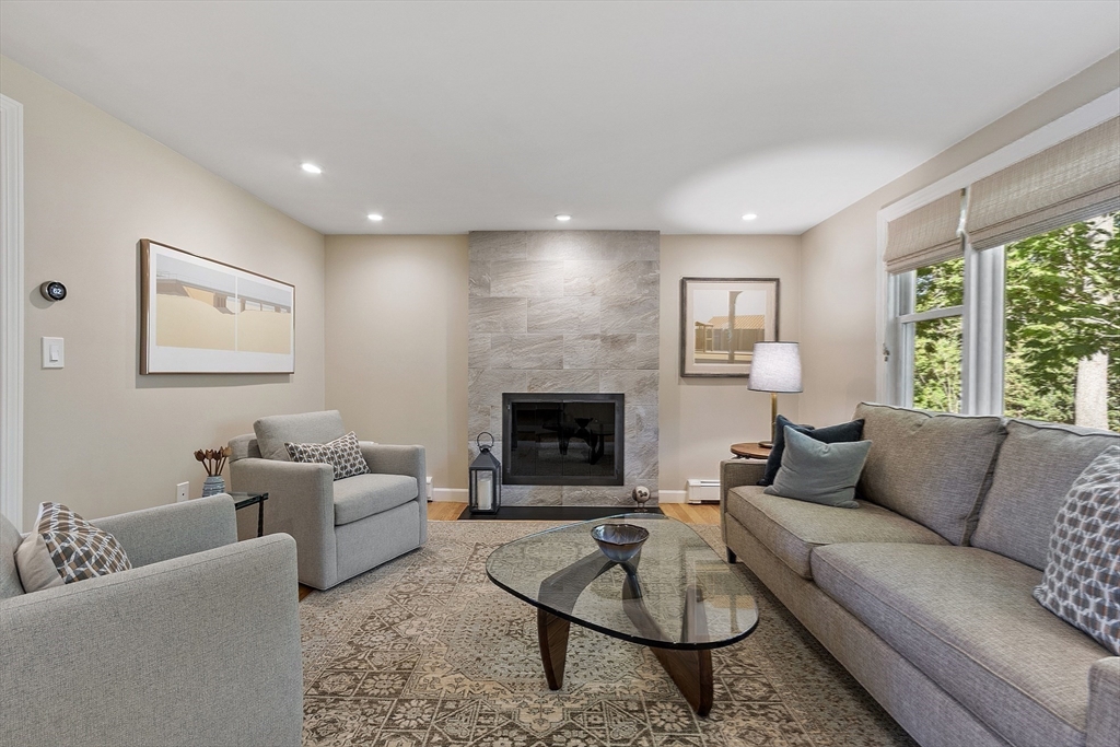 5 Crest Road Natick, MA 01760 - Photo 14 of 36 a living room with furniture and a fireplace