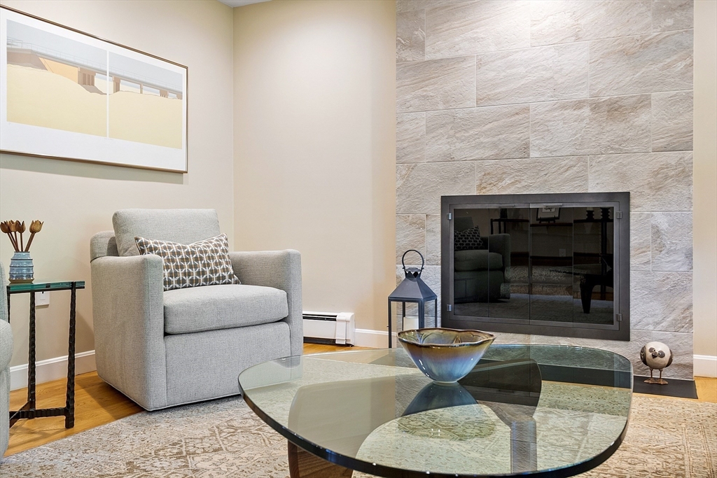 5 Crest Road Natick, MA 01760 - Photo 15 of 36 a living room with furniture and a fireplace