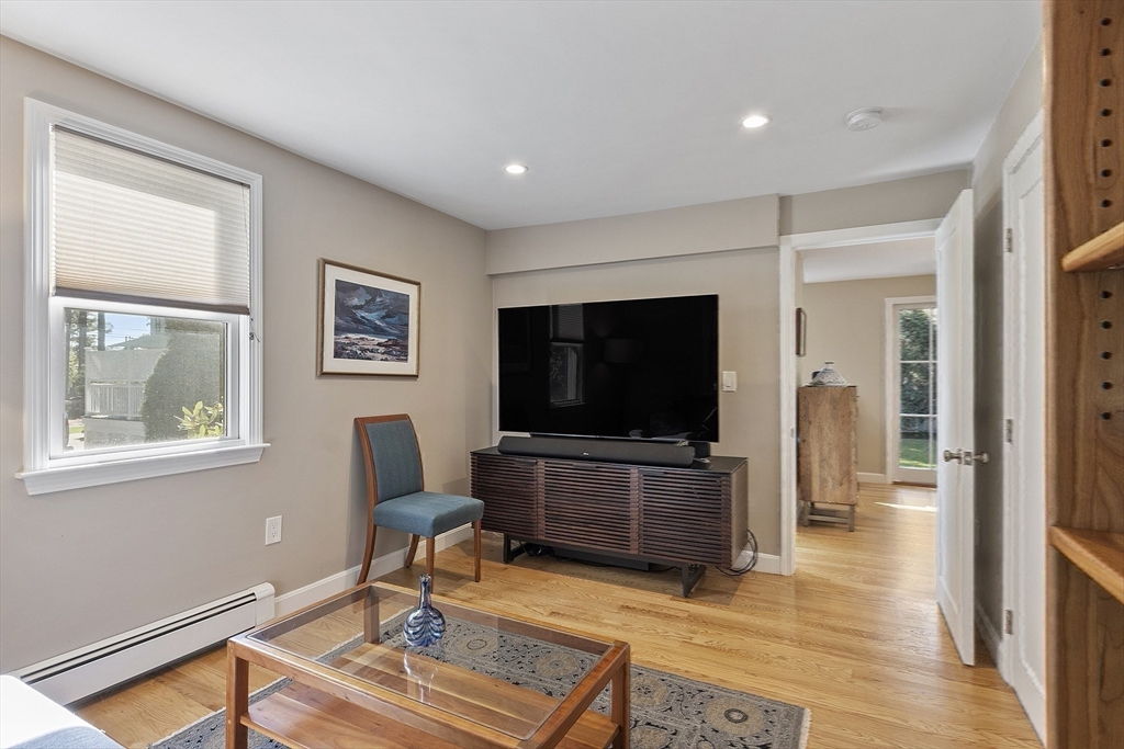 5 Crest Road Natick, MA 01760 - Photo 17 of 36 a living room with furniture and a flat screen tv