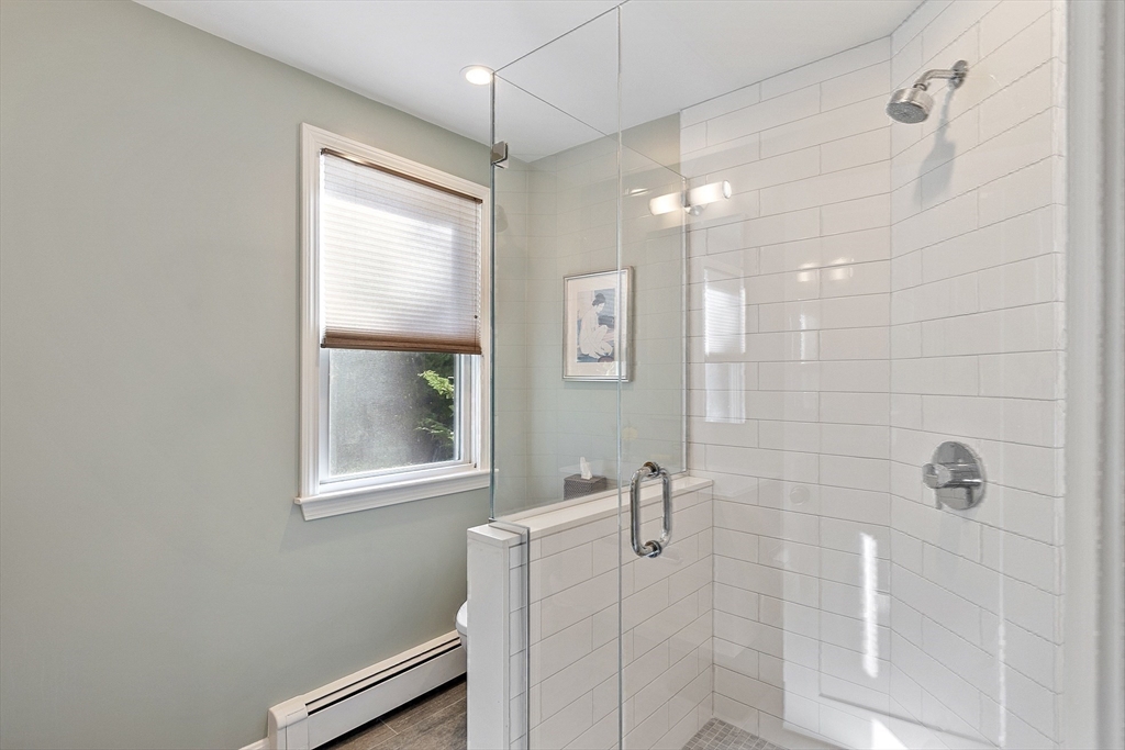 5 Crest Road Natick, MA 01760 - Photo 20 of 36 a bathroom with a window and shower