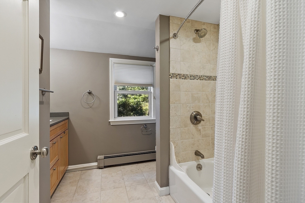 5 Crest Road Natick, MA 01760 - Photo 26 of 36 a bathroom with a bathtub and a shower