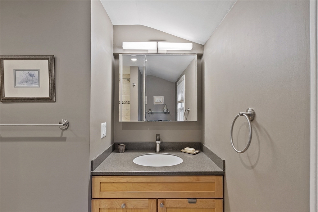 5 Crest Road Natick, MA 01760 - Photo 27 of 36 a bathroom with a granite countertop sink and a mirror