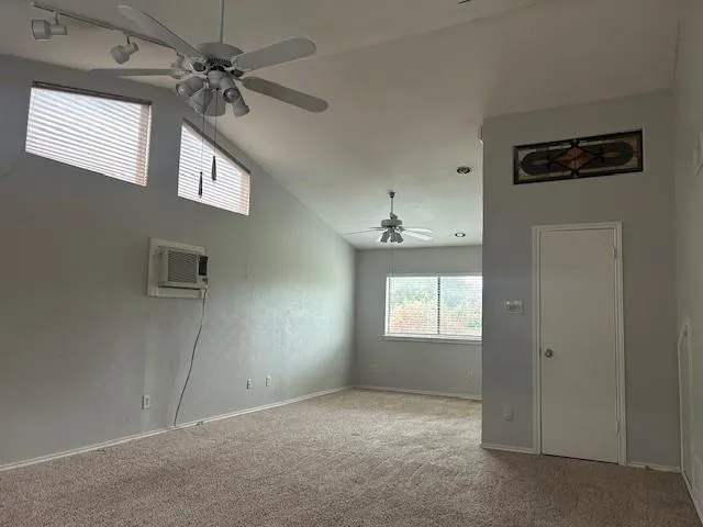 a view of an empty room with a window