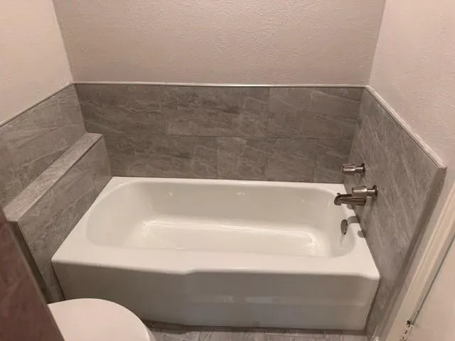 a bathroom with a bathtub