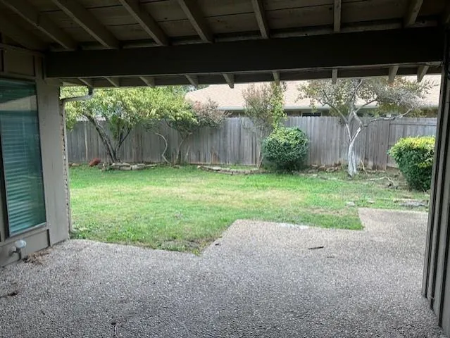 a view of a yard with an outdoor space