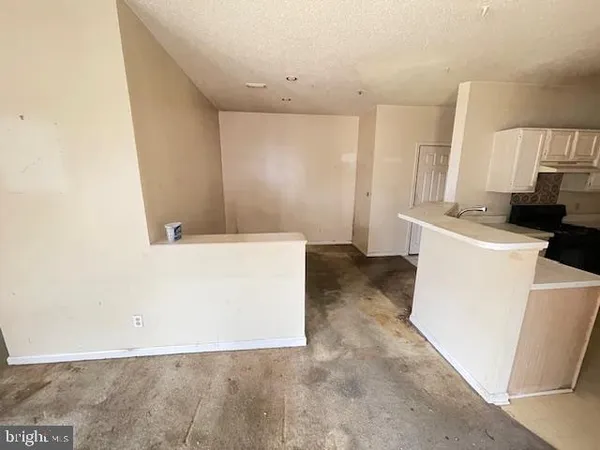 a view of a kitchen with a sink and dishwasher