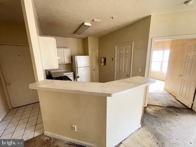 1716 Lake Shore Crest Drive, Unit 22 Reston, VA 20190 - Photo 16 of 28 a kitchen with kitchen island cabinets and sink