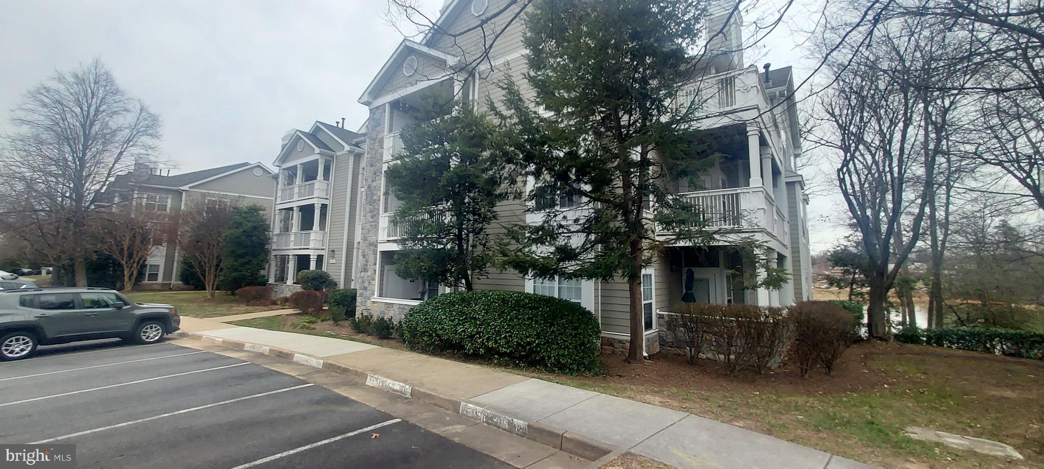1716 Lake Shore Crest Drive, Unit 22 Reston, VA 20190 - Photo 2 of 28 a view of a street with cars