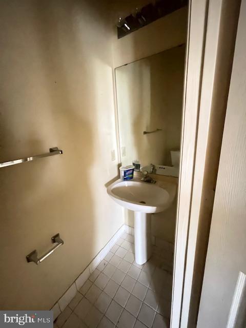 1716 Lake Shore Crest Drive, Unit 22 Reston, VA 20190 - Photo 24 of 28 a bathroom with a sink and a mirror
