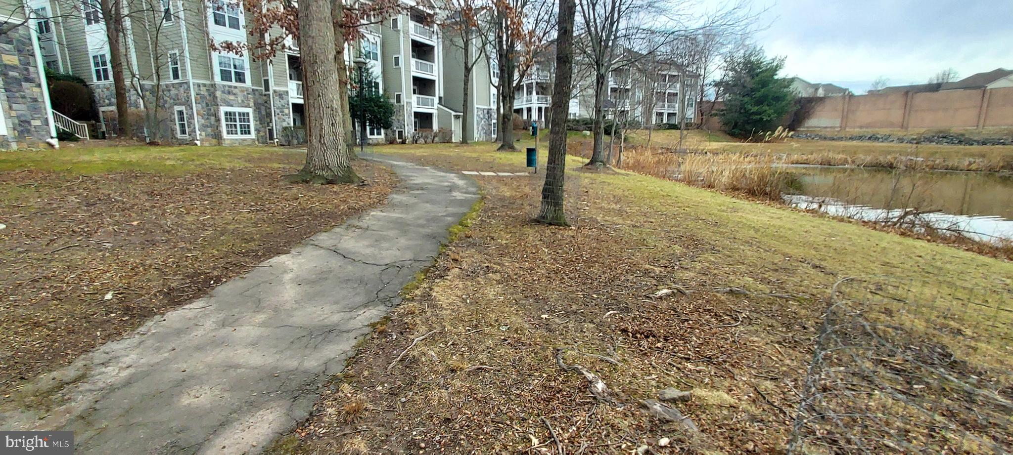 1716 Lake Shore Crest Drive, Unit 22 Reston, VA 20190 - Photo 9 of 28 a view of a yard with a house