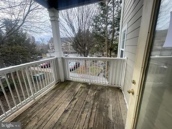 a view of balcony with wooden floor
