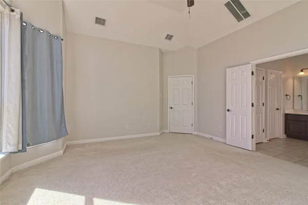 a view of empty room with floor to ceiling window
